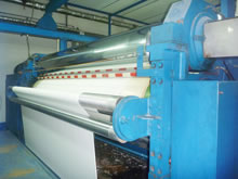 Machine de calandrage textile à trois rouleaux